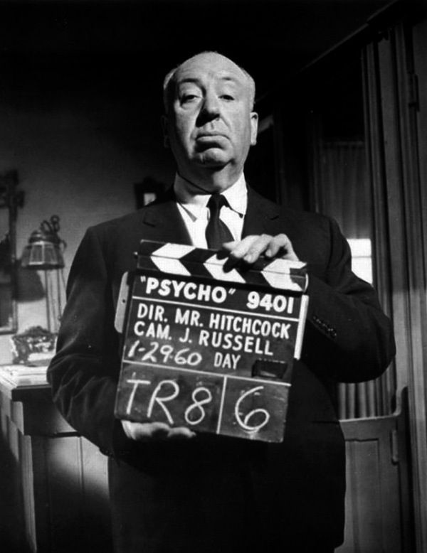 Alfred Hitchock holding a clapperboard for his film 'Psycho'