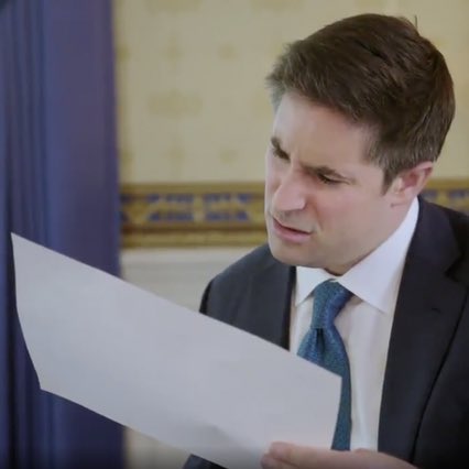 Jonathan Swan's famous focused face while reading a paper handed by Donald Trump